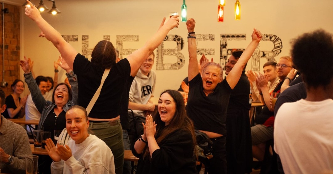 Guests cheering at a celebration in The Beer Hall
